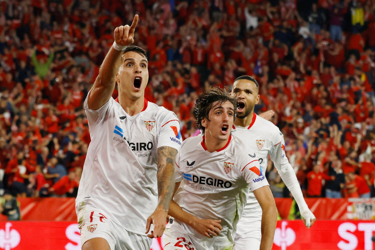 Sevilla's Erik Lamela celebrates scoring their second goal with Bryan Gil and Youssef En-Nesyri during their Europa League Semi Final Second Leg -against Juventus, at Ramon Sanchez Pizjuan, Seville, Spain on Thursday 