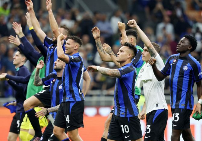 Lautaro Martinez and Nicolo Barella celebrate with their Inter Milan teammates after victory over Atalanta in the Serie A match at San Siro, Milan, Italy.