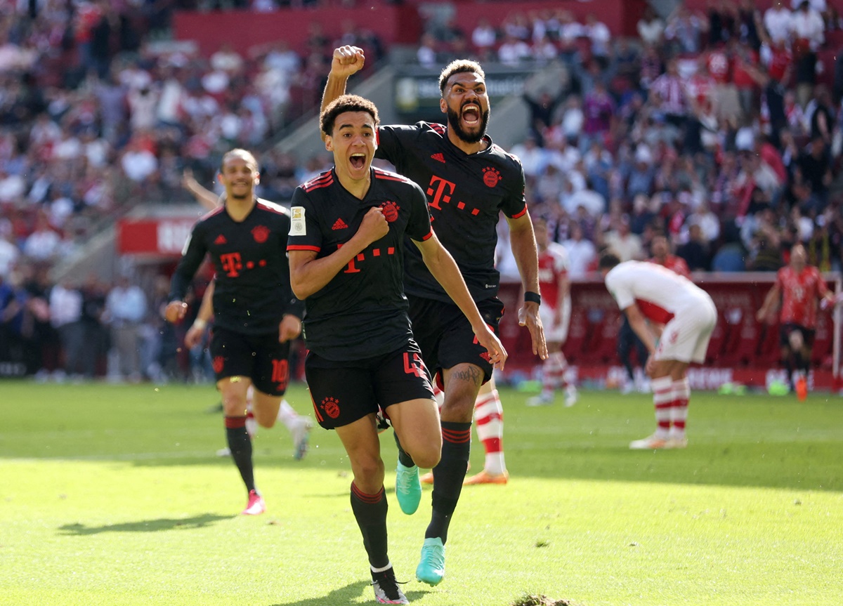 Jamal Musiala celebrates scoring Bayern Munich's second goal with Eric Maxim Choupo-Moting.