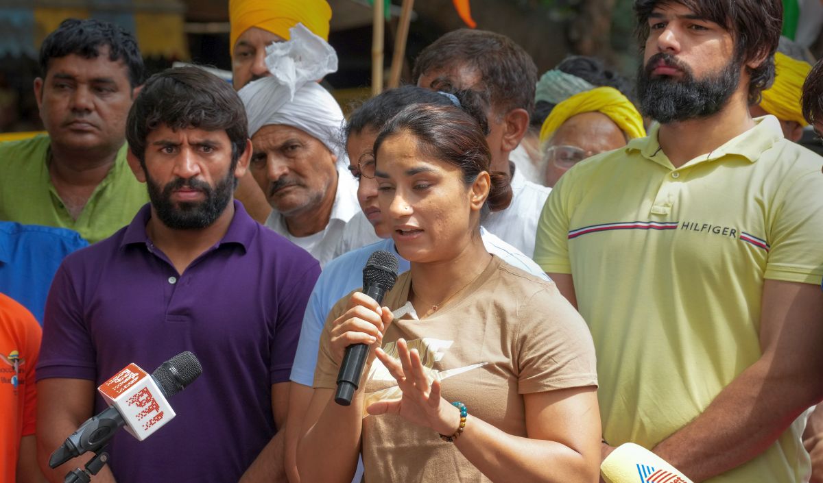 Wrestlers Vinesh Phogat and Bajrang Punia speak with the media during their protest against Wrestling Federation of India chief Brij Bhushan Sharan Singh, at Jantar Mantar in New Delhi, Sunday.