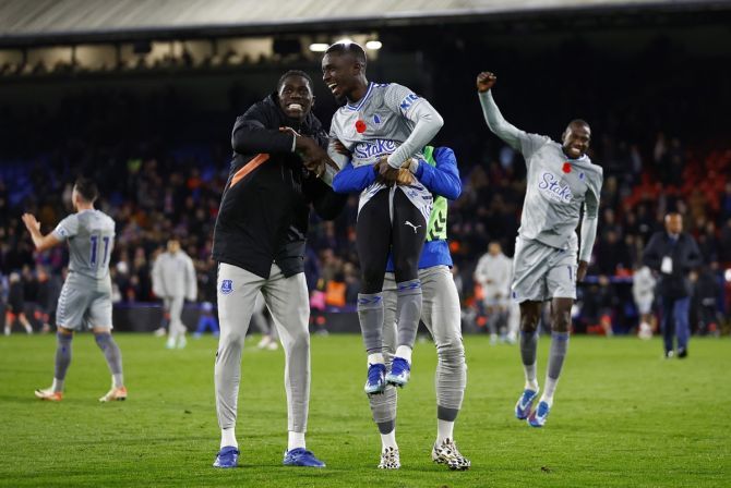 Everton's Idrissa Gueye, Amadou Onana and Arnaut Danjuma celebrate after victory over Crystal Palace.
