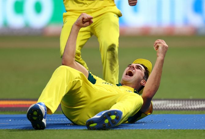 Pat Cummins celebrates taking a stunning catch to dismiss South Africa's Quinton de Kock off the bowling of Josh Hazlewood in the ICC World Cup semi-final at Eden Gardens, Kolkata, on November 16, 2023.