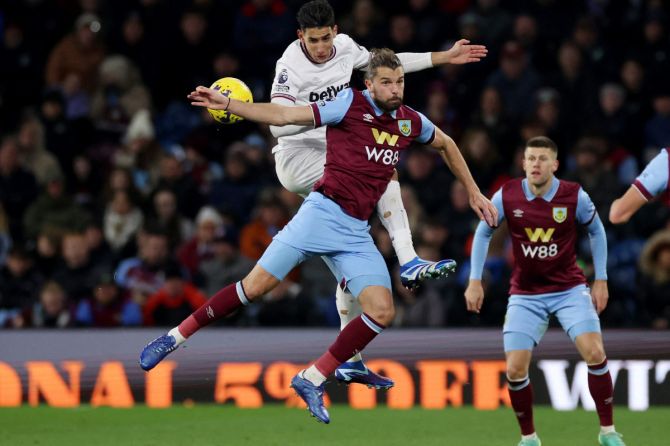 Burnley's Jay Rodriguez in action with West Ham United's Nayef Aguerd during their match at Turf Moor, Burnley 