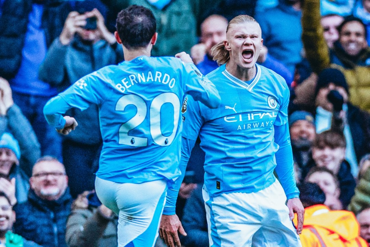 Manchester City striker Erling Haaland celebrates scoring the opening goal against Liverpool on Saturday. It was his 50th goal in the Premier League.