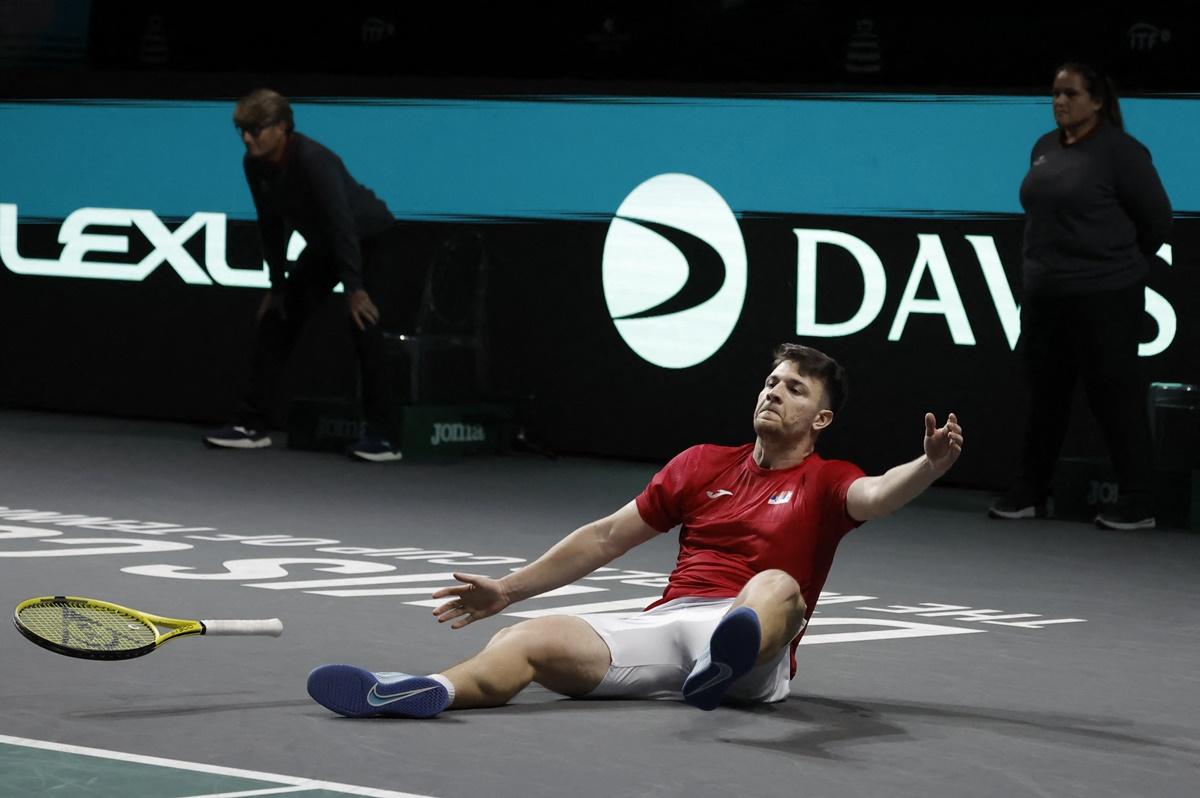 Serbia's Miomir Kecmanovic celebrates beating Italy's Lorenzo Musetti in the first singles.