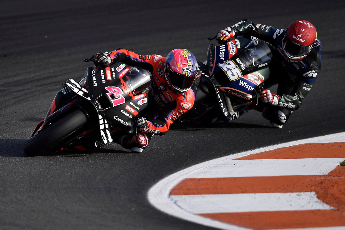 Aprilia Racing's Aleix Espargaro and CryptoDATA RNF MotoGP Team's Raul Fernandez during the Valencia Grand Prix at Circuit Recardo Tormo, Valencia, Spain on Sunday, November 26. The Race website reported that NASCAR's Trackhouse Racing team -- co-owned by rapper Pitbull -- was expected to take over the grid spots for next year using Aprilia's bikes and personnel.