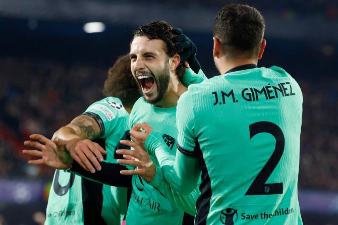 Atletico Madrid's Mario Hermoso celebrates scoring their second goal with teammates during their Group E match against Feyenoord at De Kuip, Rotterdam, Netherlands