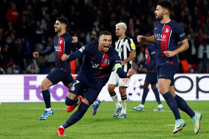 Paris St Germain's Kylian Mbappe celebrates scoring their first goal against Newcastle United during their Group F match at Parc des Princes Stadium in Paris, France.