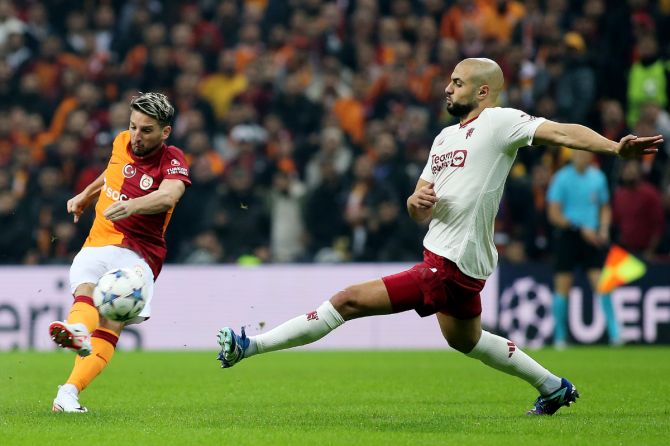 Manchester United's Sofyan Amrabat vies for the ball with a Galatasaray player during their Champions League Group A match at RAMS Park in Istanbul, Turkey on Wednesday 