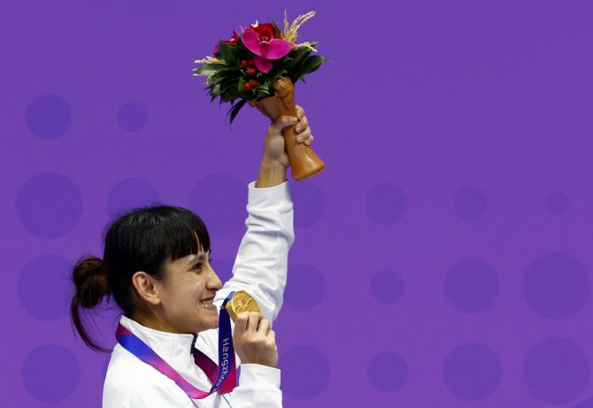 Chinese Taipei's Gu Shiau Shuang poses with her gold medal during the medal ceremony for the women's Kumite 50 kg at the Asian Games in Hangzhou on Sunday.
