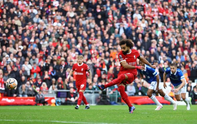 Mohamed Salah scores Liverpool's first goal from the penalty spot.