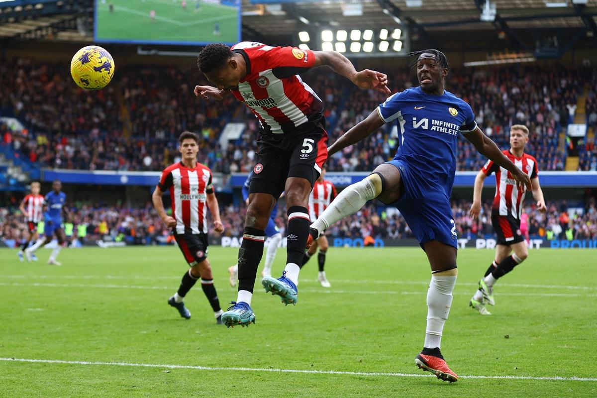 Ethan Pinnock heads the ball home for Brentford's first goal in the Premier League match against Chelsea at Stamford Bridge, London, on Saturday.