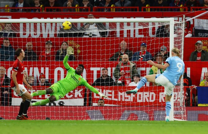 Erling Braut Haaland scores Manchester City's second goal in the Premier League match against Manchester United at Old Trafford, Manchester, on Sunday.