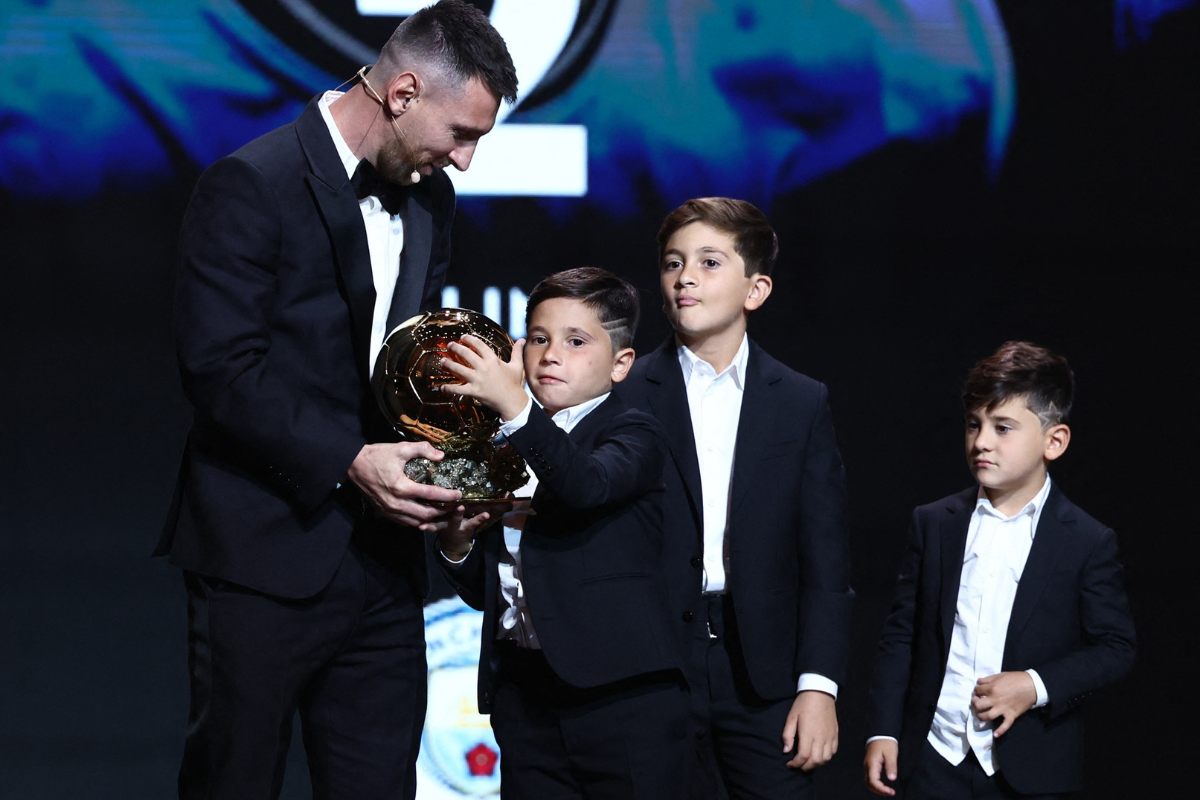 Argentina captain Lionel Messi  with his sons, Thiago, Mateo and Ciro after winning a record eighth Ballon d'Or