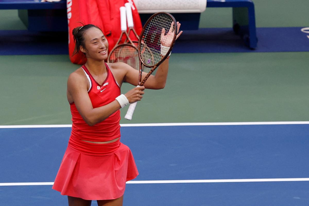 China's Qinwen Zheng  salutes the crowd after her match against Tunisia's Ons Jabeur