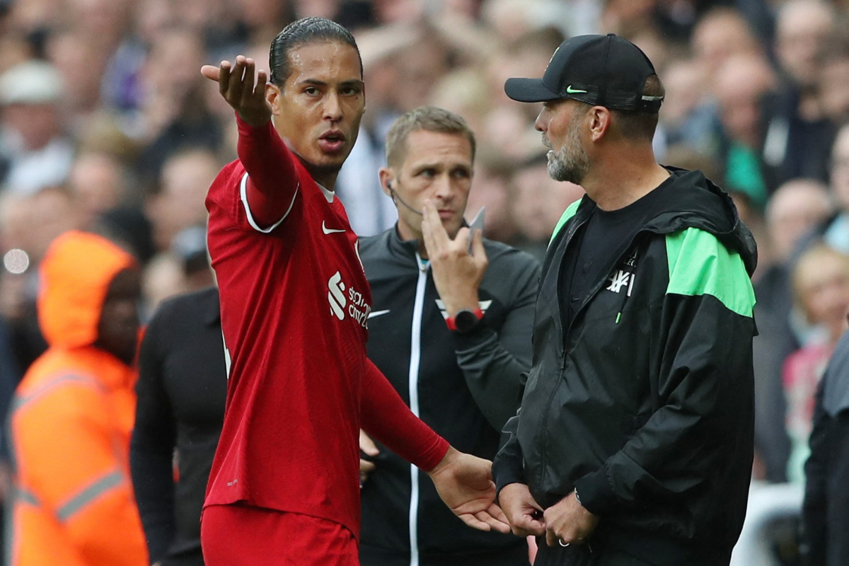 Liverpool's Virgil van Dijk remonstrates to manager Juergen Klopp after he is shown a red card during the Premier League match against Newcastle United on August 27
