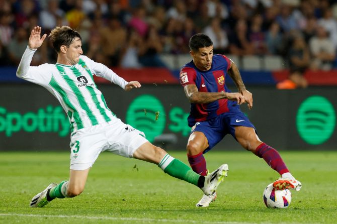 FC Barcelona's Joao Cancelo in action before he scores their fifth goal against  Real Betis at Estadi Olimpic Lluis Companys, Barcelona, Saturday 