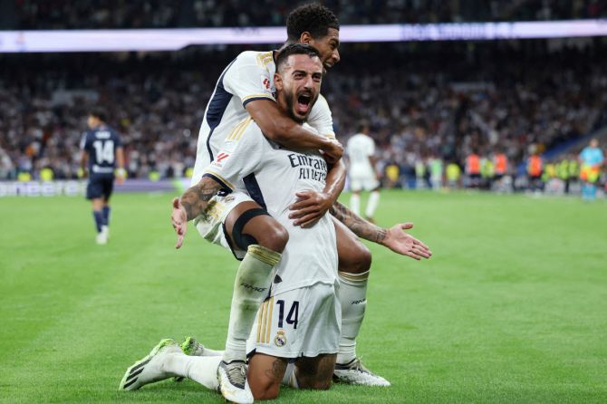 Real Madrid's Joselu celebrates with Jude Bellingham on scoring their second goal against  Real Sociedad at Santiago Bernabeu, Madrid on Sunday