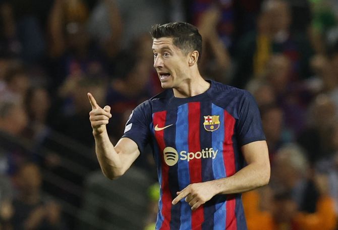 Robert Lewandowski reacts after scoring Barcelona's second goal and becoming the third player to score 100 goals in European competition after Cristiano Ronaldo and Lionel Messi.