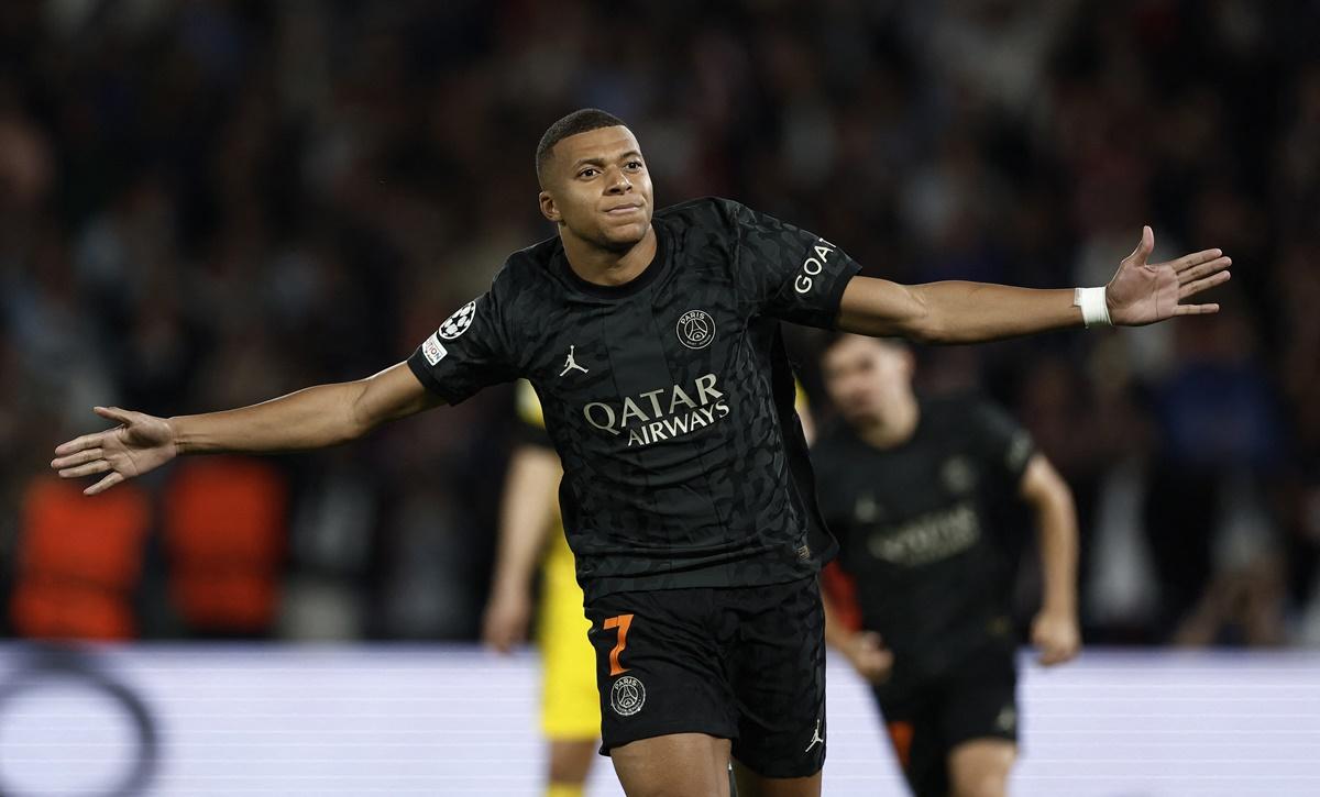 Kylian Mbappe celebrates putting Paris St Germain ahead from the penalty spot during the Group F match against Borussia Dortmund at Parc des Princes, Paris.