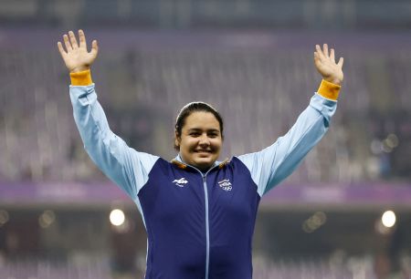 Kiran Baliyan celebrates on the podium after winning shot put bronze at the Asian Games in 2023