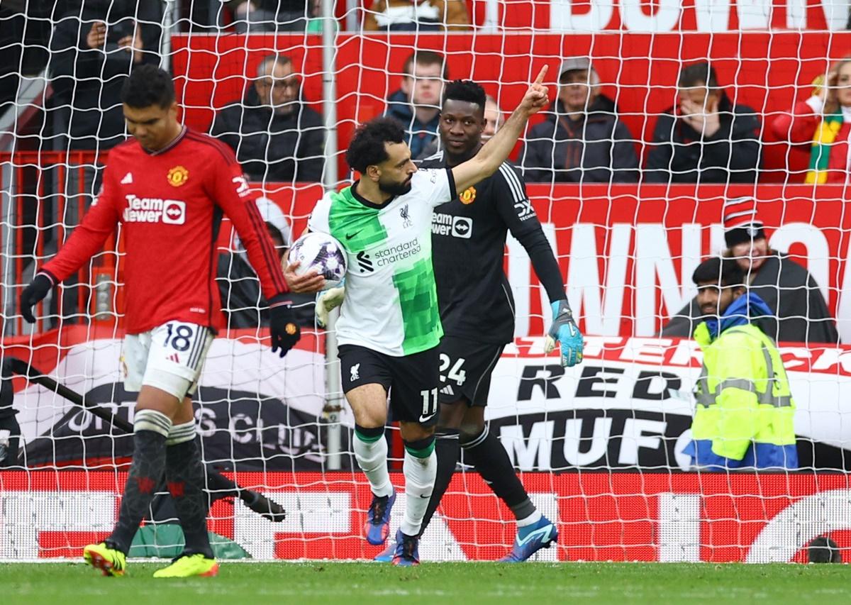 Mohamed Salah celebrates scoring Liverpool's second goal from the penalty spot late in the Premier League match against Manchester United at Old Trafford on Sunday.