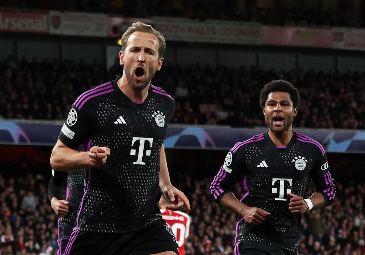 Harry Kane celebrates scoring Bayern Munich's second goal with Serge Gnabry during the Champions League quarter-final first leg at Emirates Stadium, London, on Tuesday.