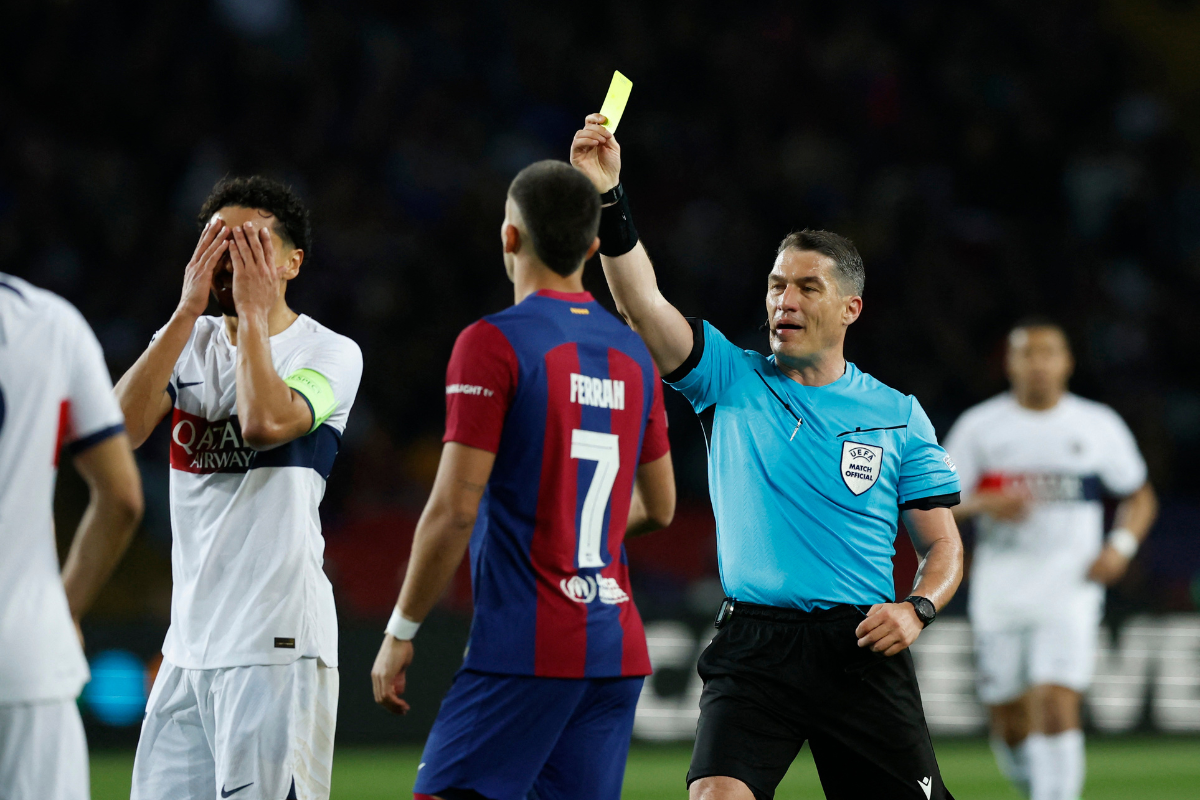 Paris St Germain's Marquinhos is shown a yellow card by referee Istvan Kovacs during the Champions League Quarter Final Second Leg match between FC Barcelona and Paris St Germain at Estadi Olimpic Lluis Companys, in Barcelona, on Tuesday.