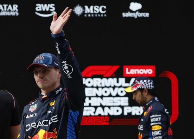 Red Bull's Max Verstappen celebrates qualifying in pole position for the Chinese Grand Prix as second-placed Red Bull's Sergio Perez looks on at the Shanghai International Circuit on Saturday.