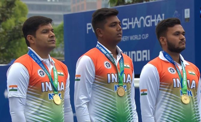 The men's Compound team of Abhishek Verma, Priyansh and Prathamesh Fuge on the victory podium.