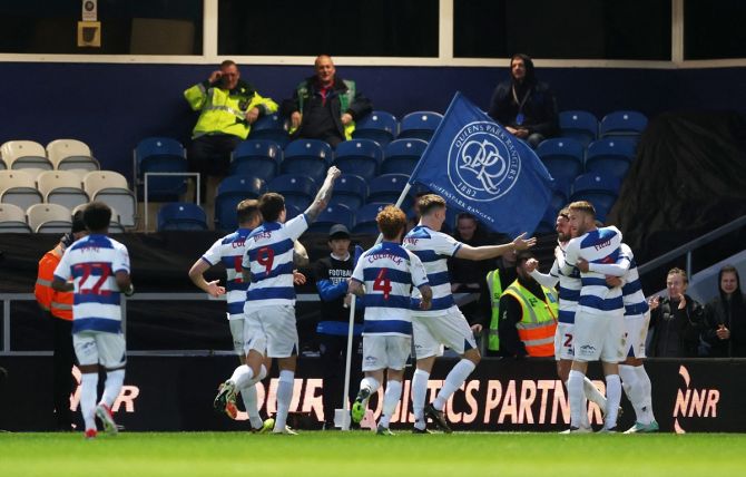 Lucas Andersen celebrates scoring Queens Park Rangers's second goal with teammates in the  Championship match against Leeds United, at Loftus Road, London, on Friday.