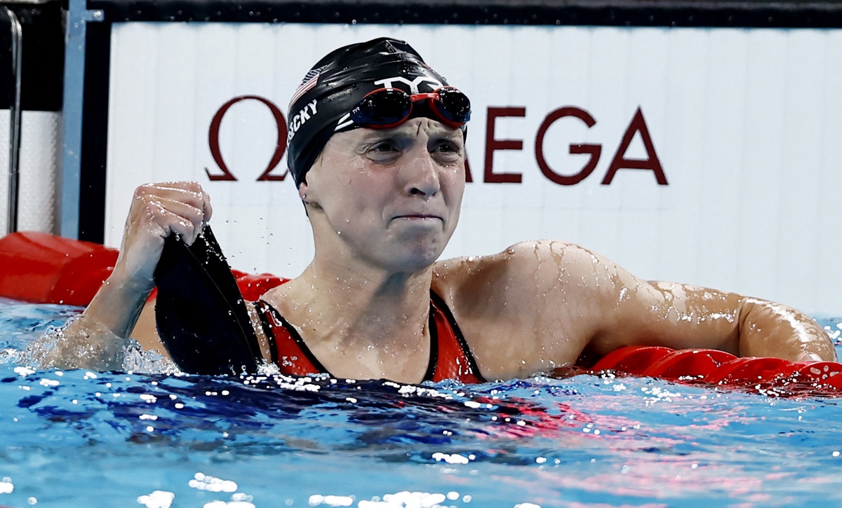 Katie Ledecky of United States celebrates winning gold and setting a new Olympic record in the women's 1500m Freestyle final