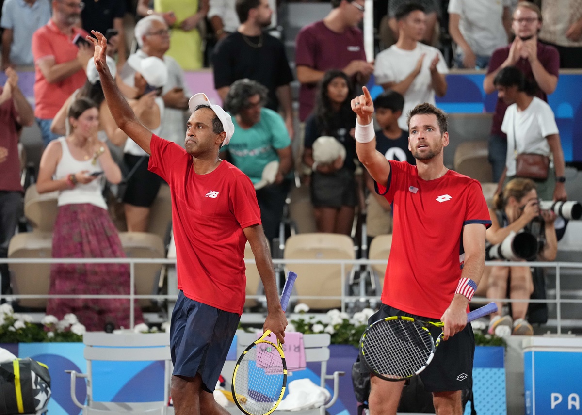 Rajeev Ram and Austin Krajicek of the United States celebrate victory over Spain's Carlos Alcaraz and Rafael Nadal in the Olympics men's doubles quarter-finals at Stade Roland Garros, Pzaris, on Wednesday.