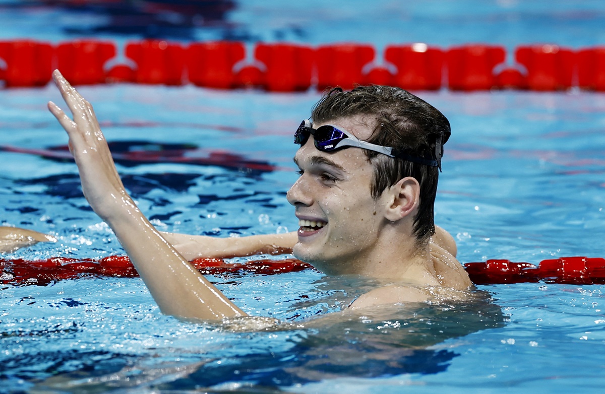 Hungary's Hubert Kos celebrates after winning gold in the men's 200m Backstroke final.