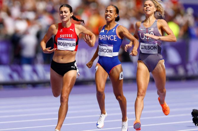 Anais Bourgoin of France, Valentina Rosamilia of Switzerland and Allie Wilson of United States react after crossing the line in first, second and third place in heat 2 of the Athletics, Women's 800m Repechage Round at Stade de France, Saint-Denis, France, on Friday.