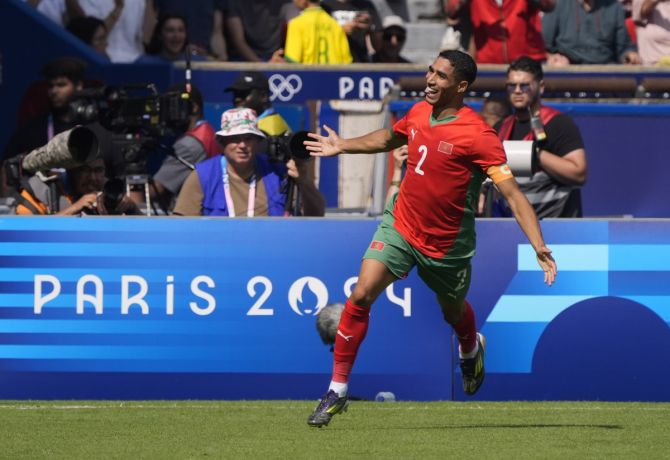 Morocco's Achraf Hakimi celebrates scroing against the United States.