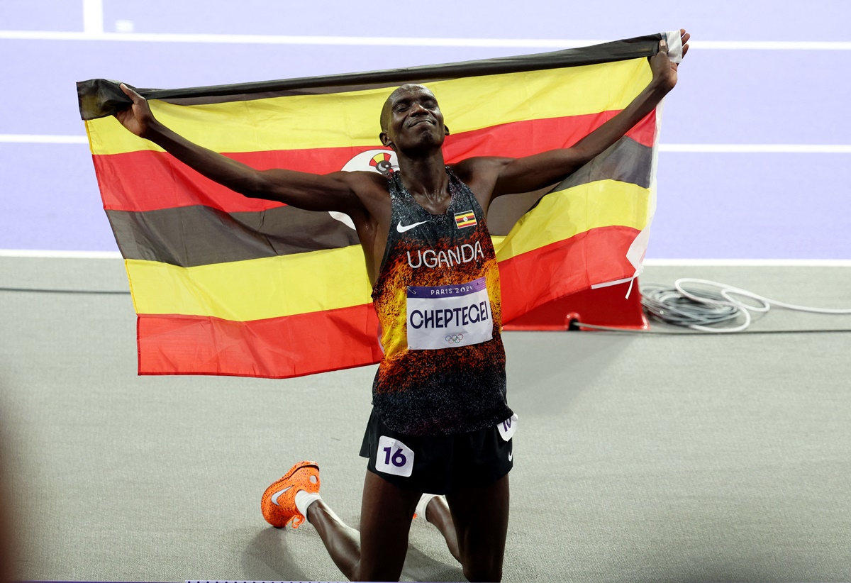 Uganda's Joshua Cheptegei celebrates winning the Olympics men's 10,000m final at Stade de France, Saint-Denis, in Paris, on Friday.