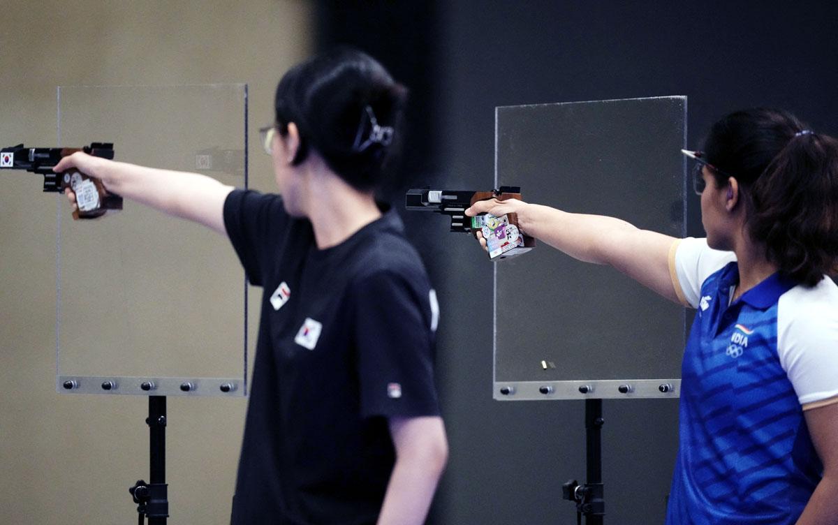 Jiin Yang of South Korea and Manu Bhaker of India in action in the women's 25m final at the Paris Olympics on Saturday.