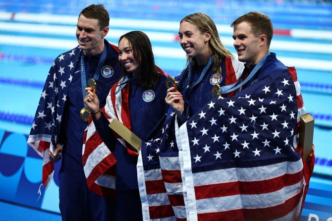 Gold medallists Ryan Murphy, Nic Fink, Gretchen Walsh and Torri Huske of United States pose with their medals as they celebrate winning the Mixed 4 x 100m medley relay.