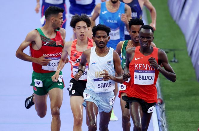 India's Avinash Mukund Sable shares the early lead with Kenya's Abraham Kibiwot during Heat 2 of the Olympics men's 3000m Steeplechase at Stade de France, Saint-Denis, Paris, on Monday.