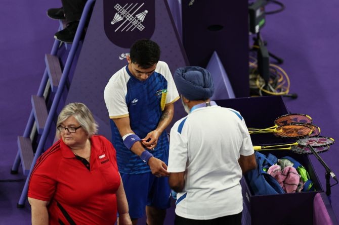 Lakshya Sen receives medical attention during the match against Zii Jia Lee 