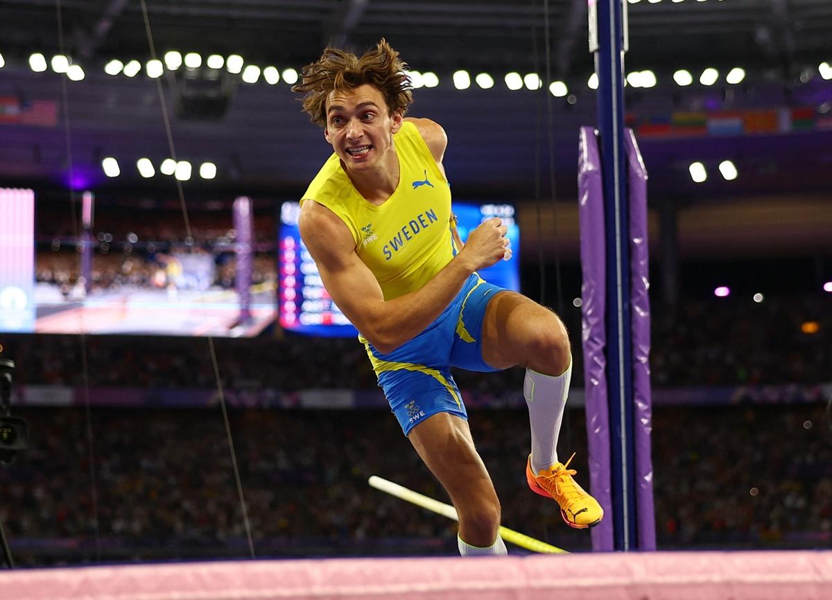 Sweden's Armand Duplantis celebrates winning gold and establishing a World record in the  Olympics men's Pole Vault final at Stade de France, Saint-Denis, Paris, on Monday.