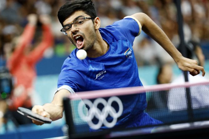 Men's Team Round of 16 - South Paris Arena 4, Paris, France - August 06, 2024. Manav Vikash Thakkar of India in action during his round of 16 team match against Chuqin Wang of China