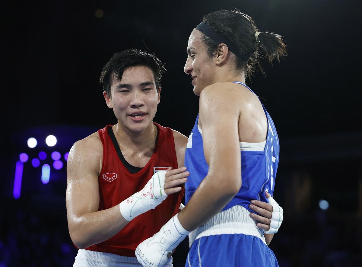 Imane Khelif and Janjaem Suwannapheng embrace after the bout.