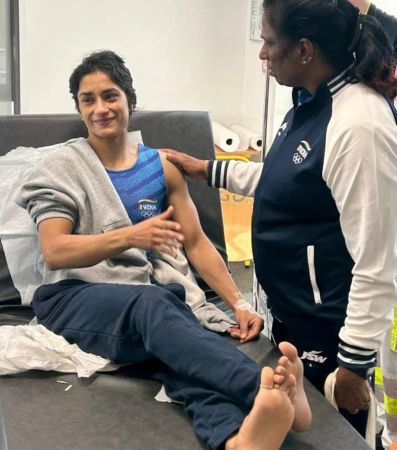 Indian Olympic Association chief P T Usha meets with Vinesh Phogat at the polyclinic in the Olympic Games Village in Paris 