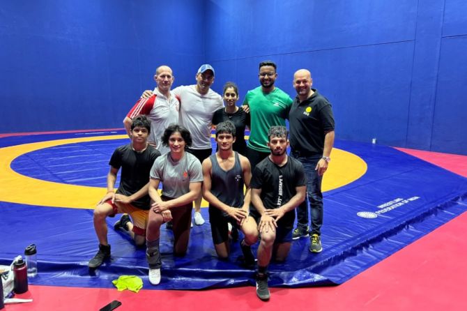  Vinesh's support staff included coach Woller Akos, Lombard, Ashwini Jeevan Patil (Physio), Manyank Singh (mental conditioning expert), and Arvind (sparring partner).