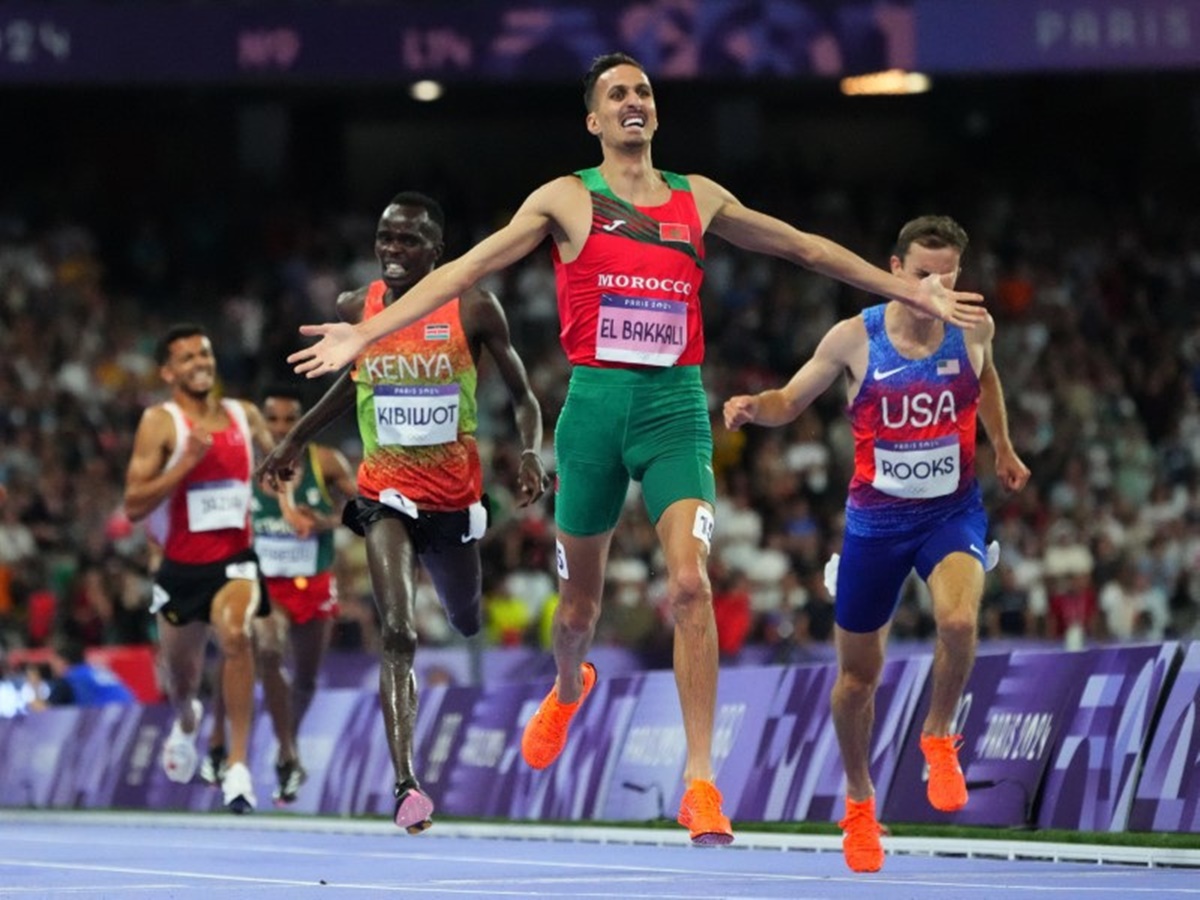 Morocco's Soufiane El Bakkali crosses the line to win gold, ahead of silver medallist Kenneth Rooks of the United States and bronze medallist Abraham Kibiwot of Kenya in the Olympics men's 3000 metres Steeplechase final at Stade de France, Saint-Denis, Paris, on Wednesday.