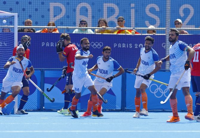 India's players celebrate after Harmanpreet Singh scores