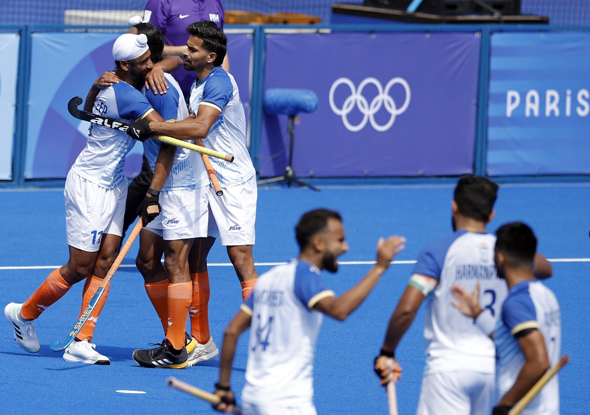 India's players celebrate their second goal of the match 