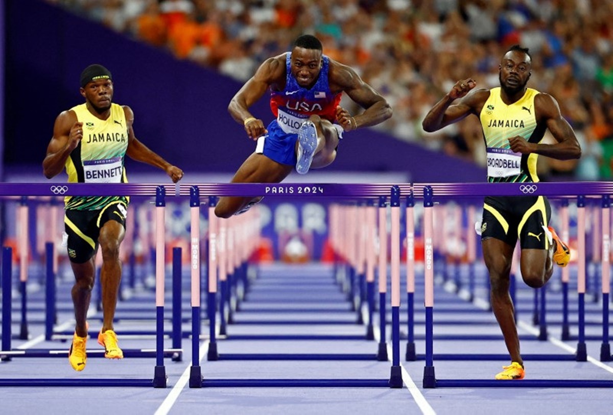 Grant Holloway of the United States goes over the last obstacle on his way to the gold medal in the men's 110 metres hurdles.